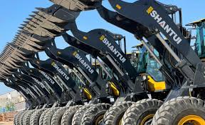 Shantui L36 wheel loader loading aggregate at sunset